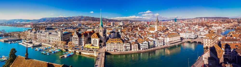 stock-photo-view-of-historic-zurich-city-center-with-famous-fraumunster-church-limmat-river-and-zurich-lake-517931935